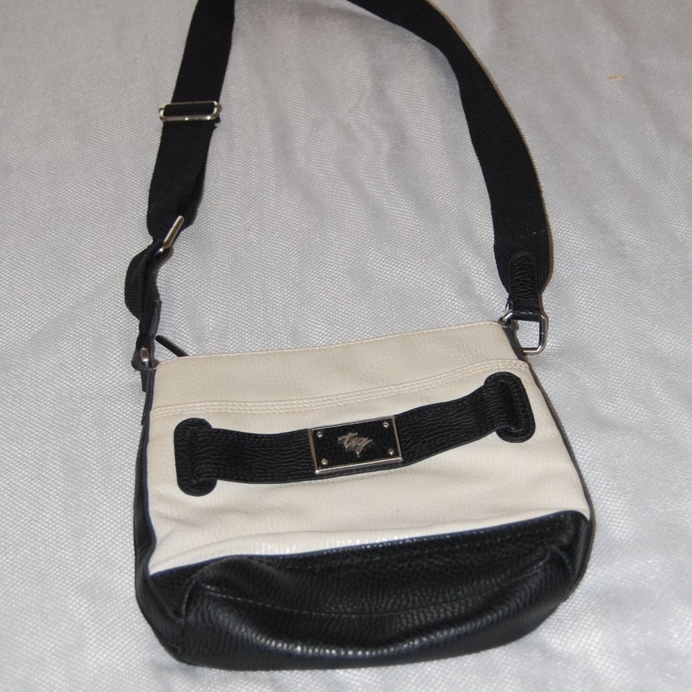 TIG White Faux Leather Cross Body Purse With Black Trimming and Cloth Strap.